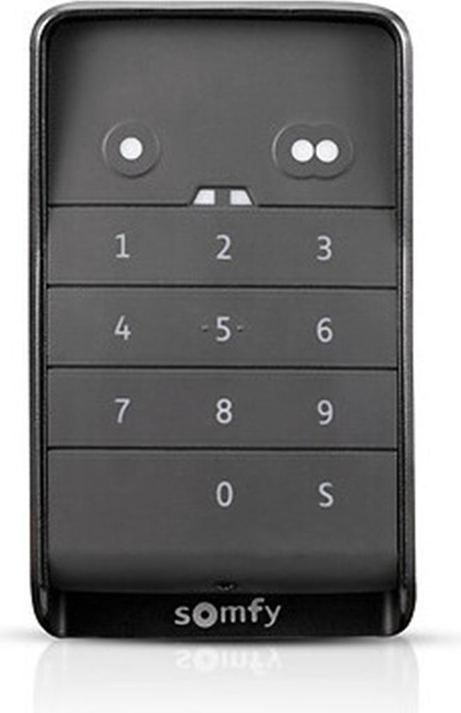 A black and gray Somfy remote control with a numeric keypad and two circular buttons at the top.