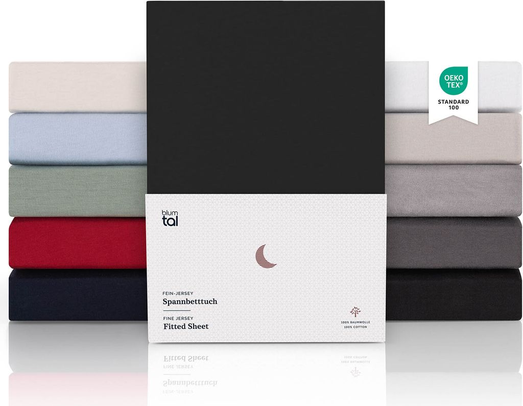 A stack of folded fitted sheets in various colors, with a product package in the foreground.
