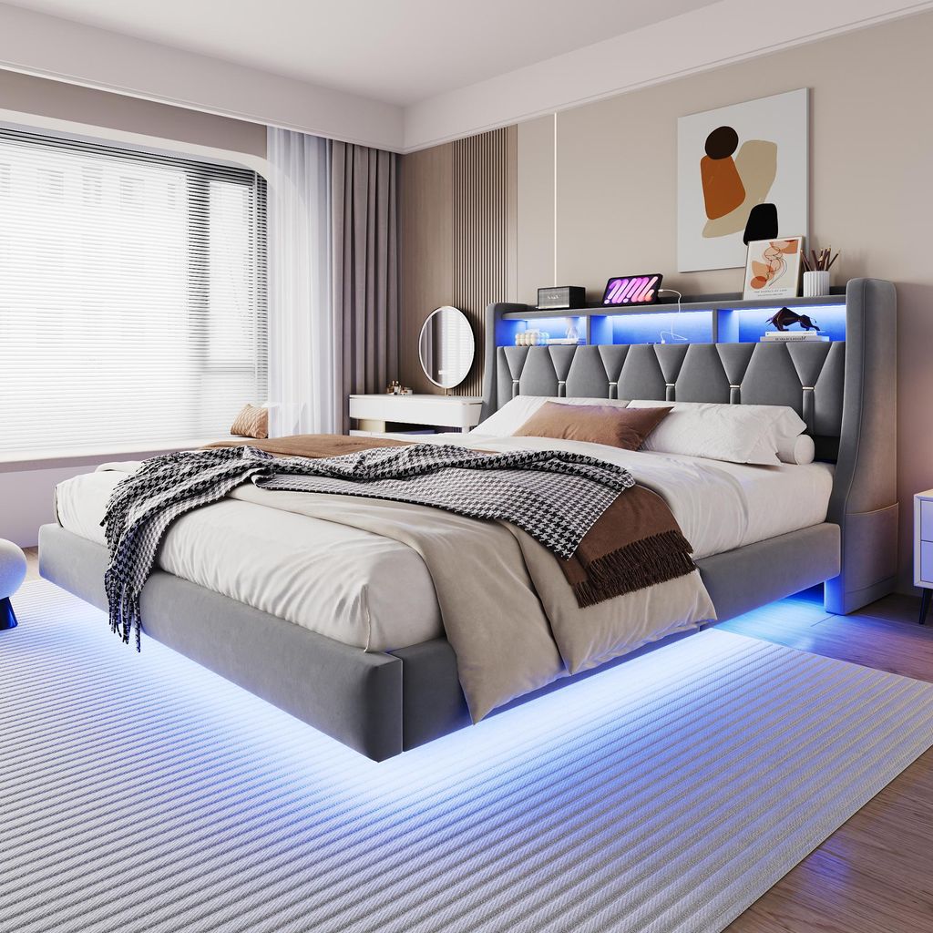 A modern bedroom with a bed featuring LED lighting.