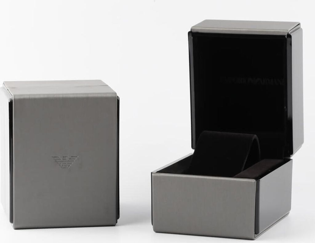 Two grey watch boxes, one closed and one open, against a white background.