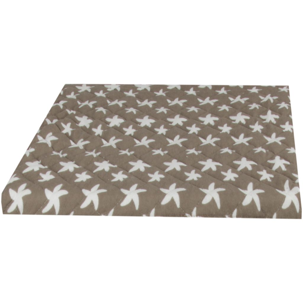A quilted cover with a star pattern.