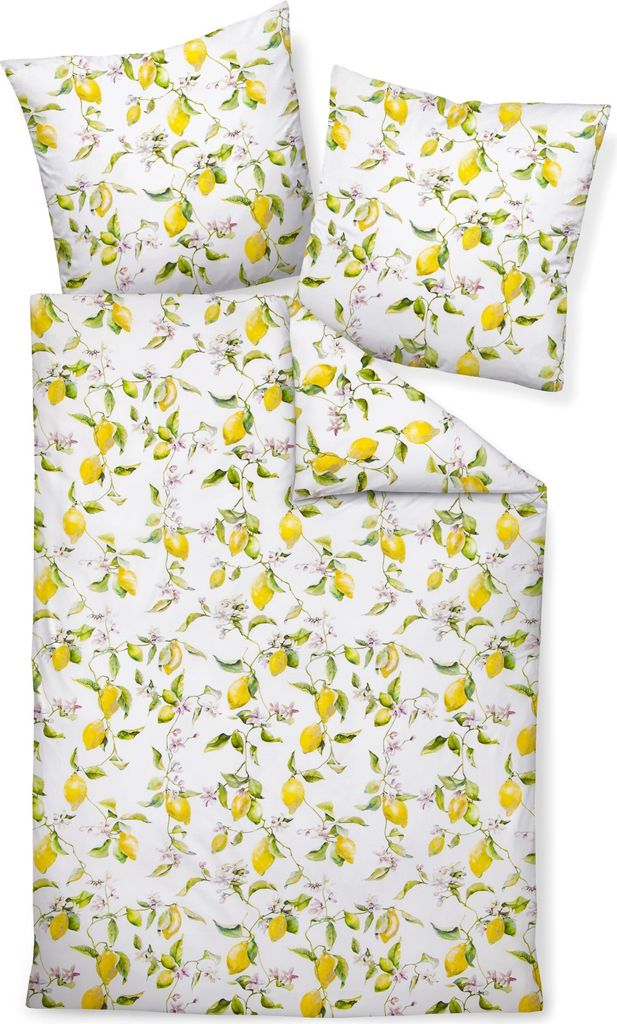 A flat lay of a bedding set with a lemon pattern.