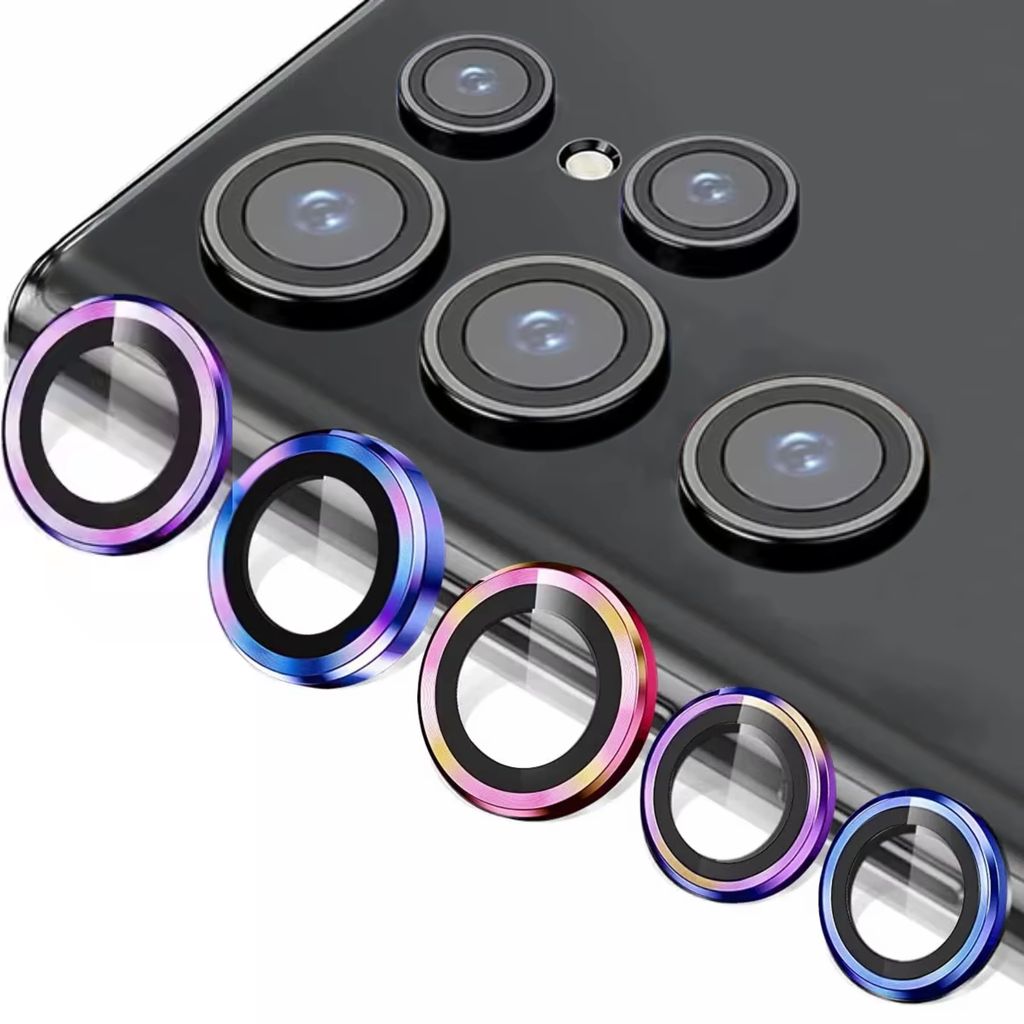 A close-up view of multiple colorful camera lens protectors arranged in front of a smartphone's camera array.