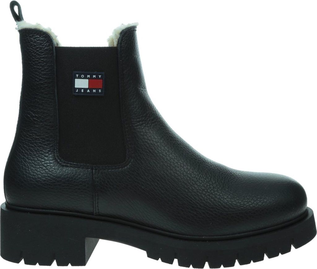 A black Tommy Hilfiger Chelsea boot with a white and red logo on the side.
