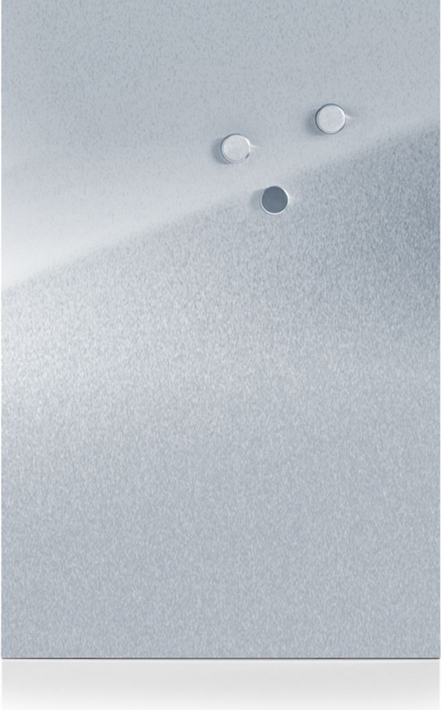 A close-up view of a metallic surface with three small circular indentations or holes.