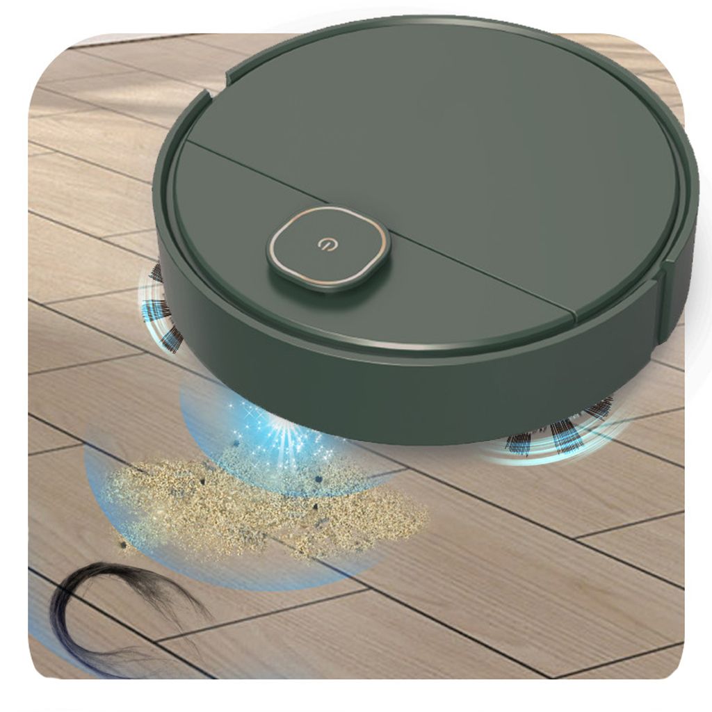 A dark green robot vacuum cleaner is shown cleaning a wooden floor, with dust and hair being sucked up.