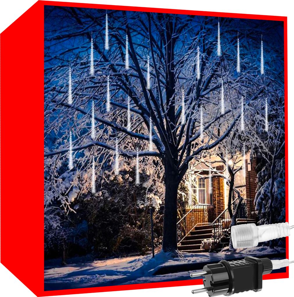 A snowy outdoor scene at night with a house and a tree decorated with icicle-shaped lights.