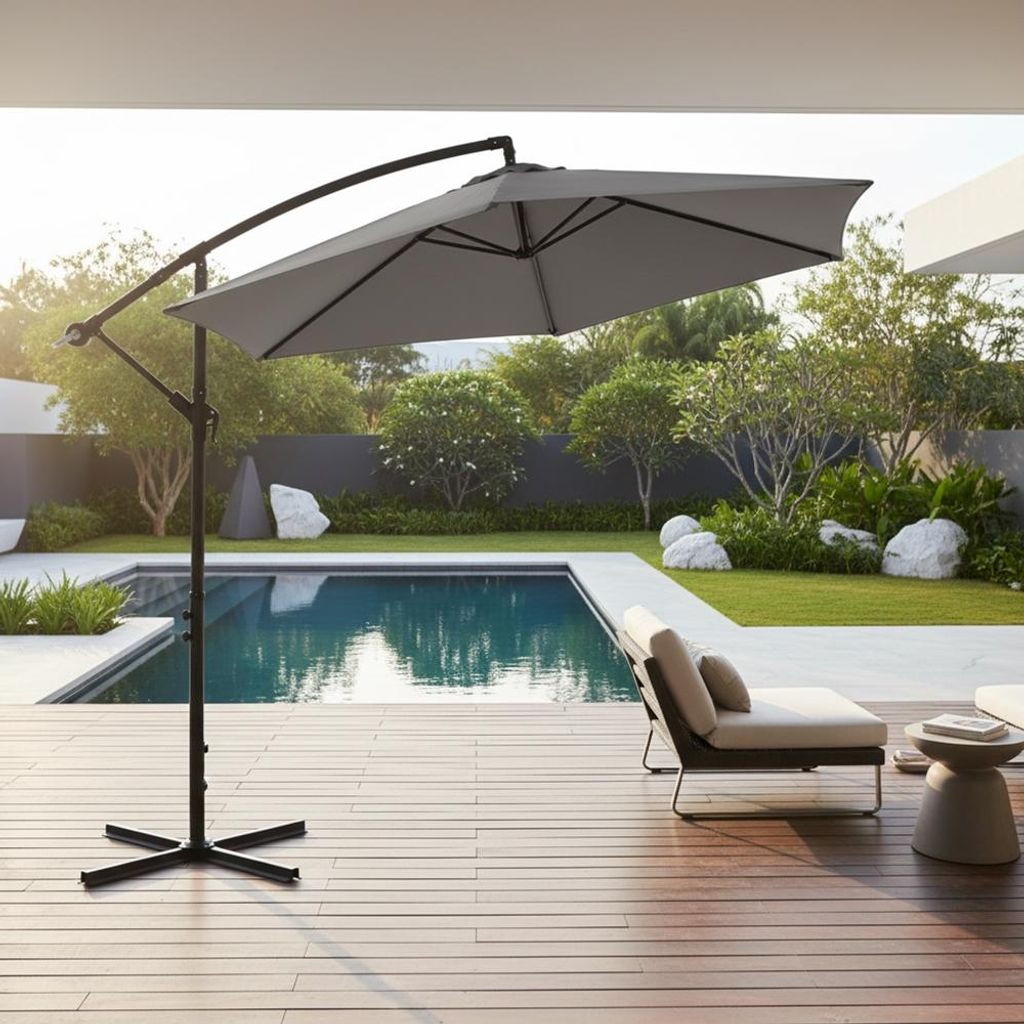 A patio area with a swimming pool, lounge chair, and a large cantilever umbrella.