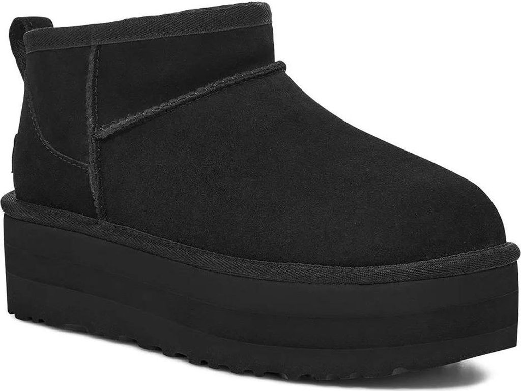 A black UGG platform boot is shown from the side against a white background.