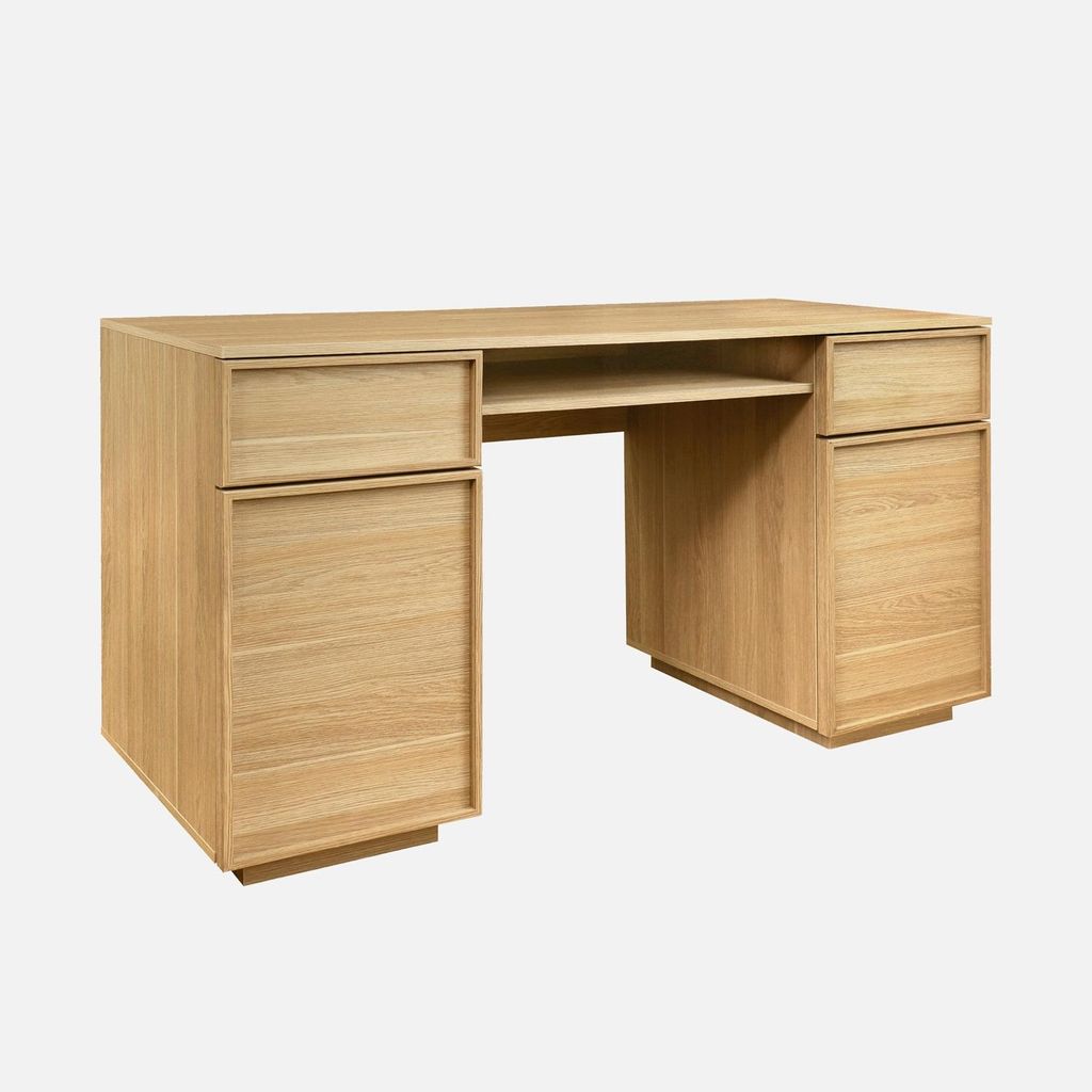 A wooden desk with drawers and a shelf, presented against a white background.