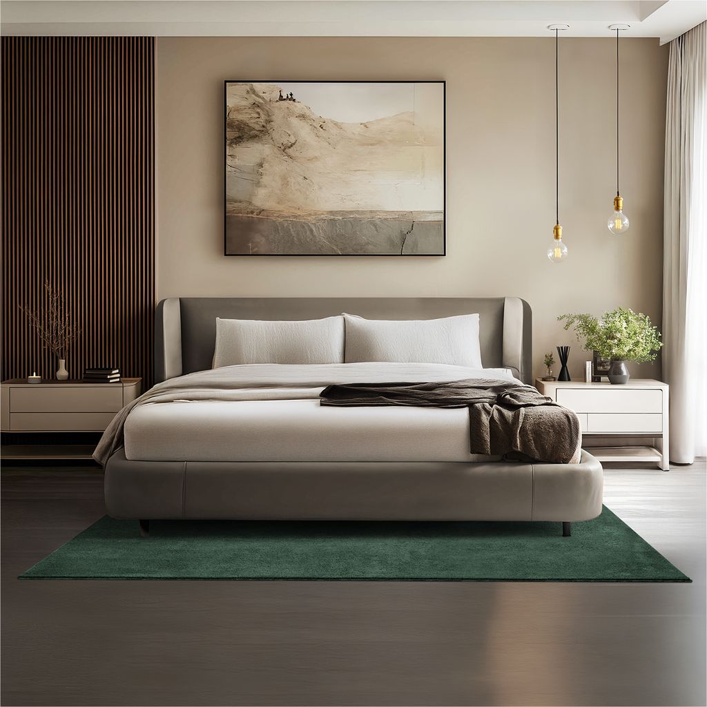 A bedroom scene with a bed, nightstands, and artwork.
