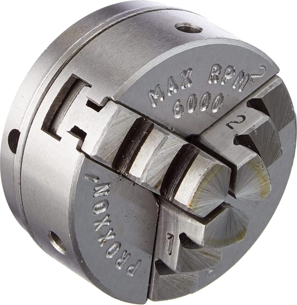A close-up, angled view of a metal three-jaw chuck, likely for a lathe or similar machine tool.