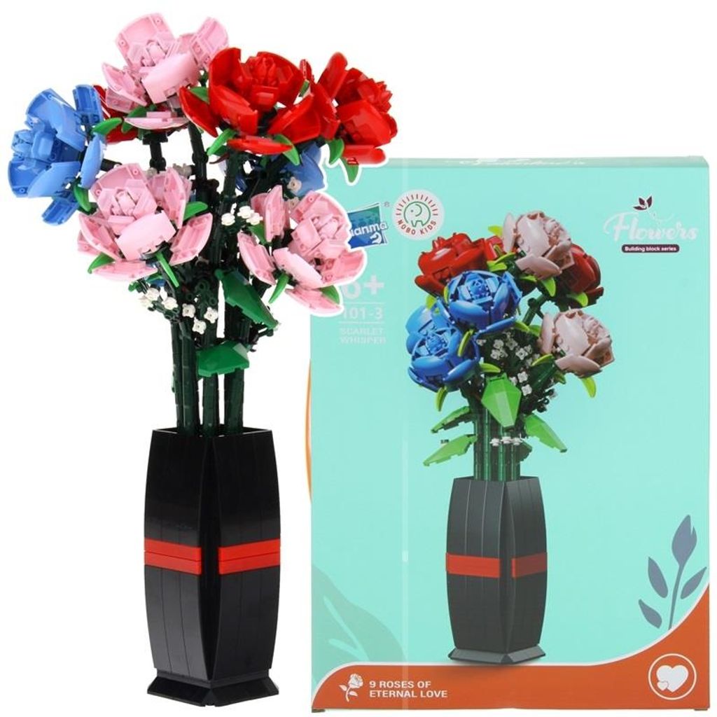 A bouquet of artificial roses in a vase next to its packaging.