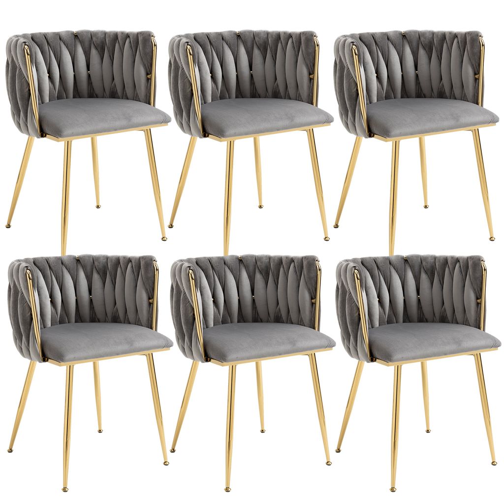 A set of six gray velvet dining chairs with gold metal frames, arranged in two rows of three.