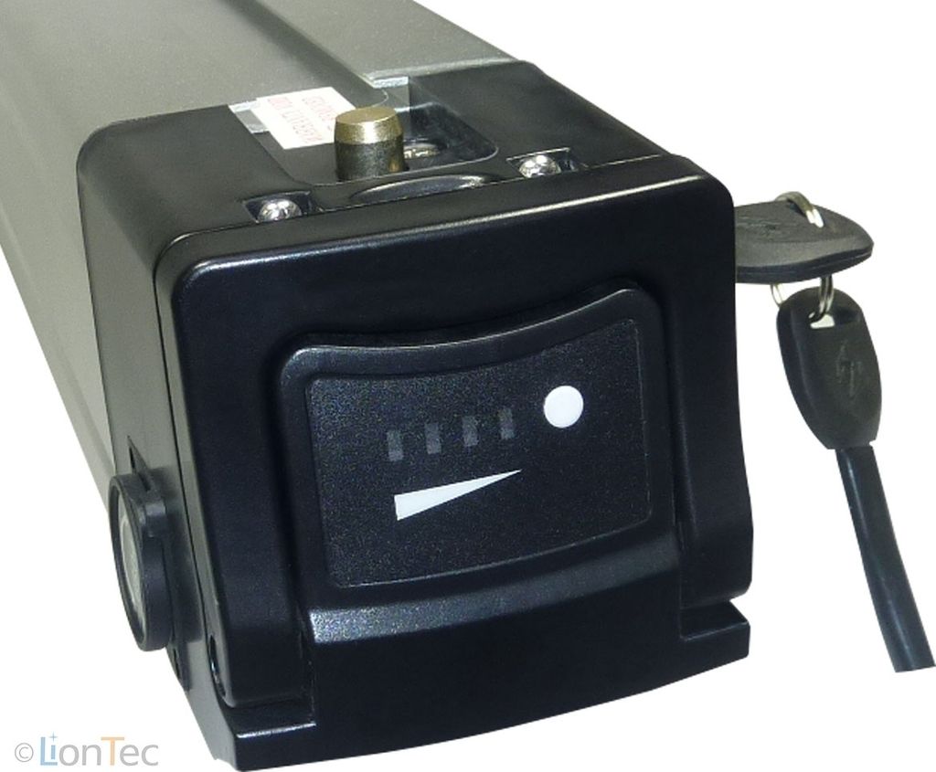 A close-up view of an e-bike battery pack with a key and a charge indicator.