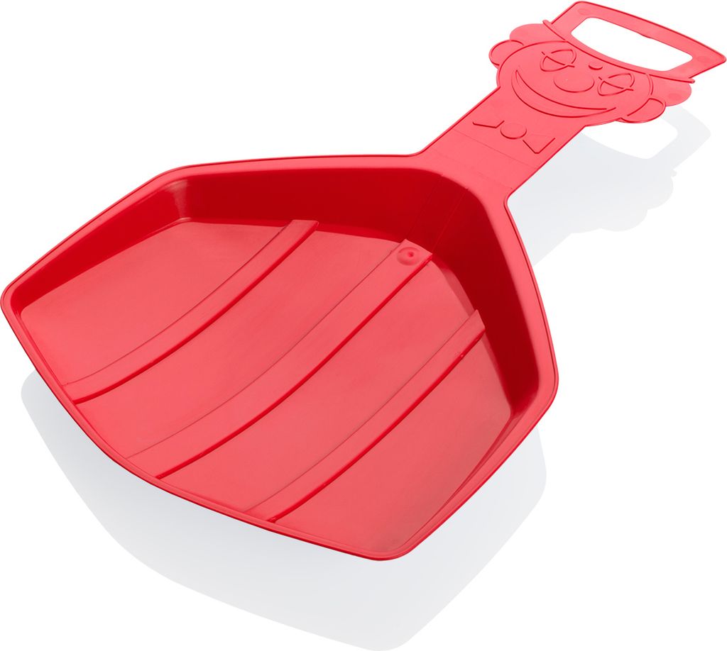 A red plastic snow shovel with a cartoon face on the handle.
