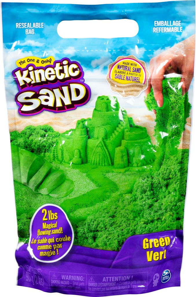 A bag of green kinetic sand with a castle built from the sand on the front.