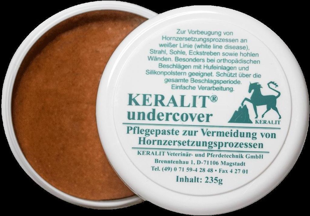 A white tub of Keralit Undercover Pflegepaste with a brown paste inside.