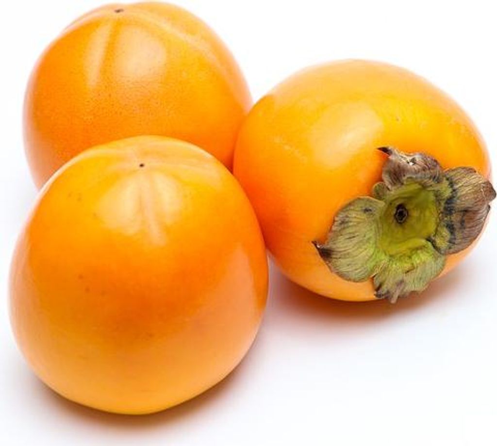Three ripe persimmons are arranged on a white background.