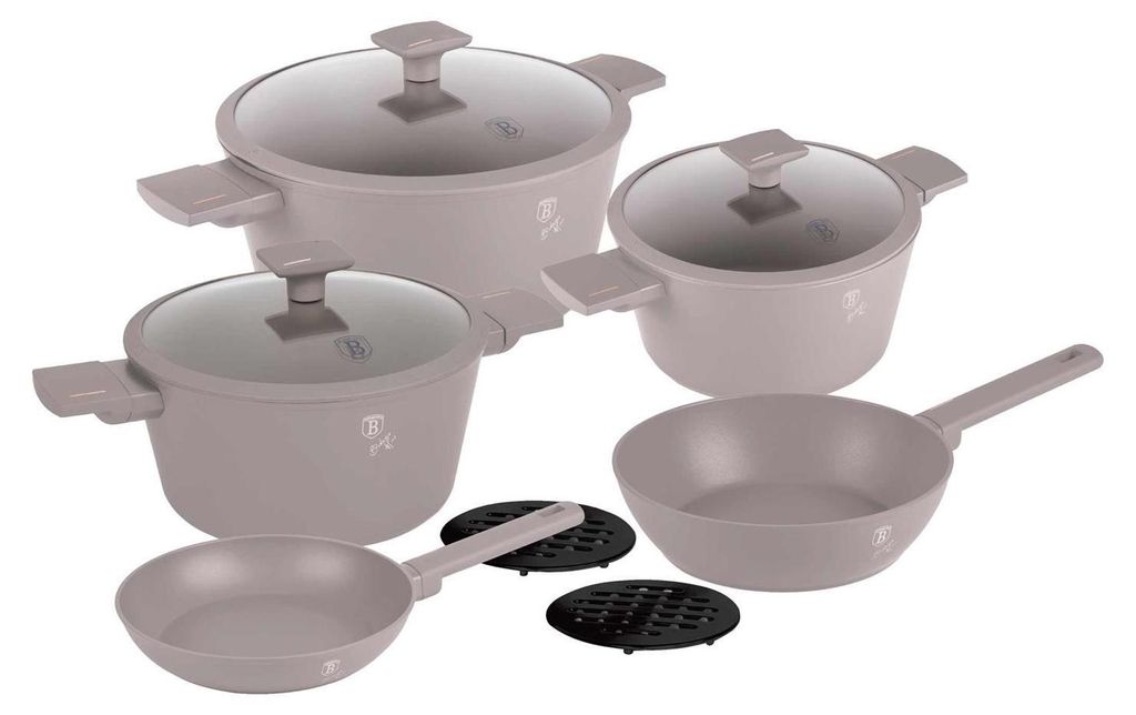 A set of cookware and frying pans arranged on a white background.