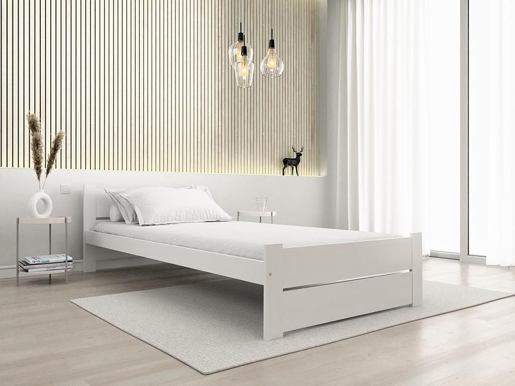 A minimalist bedroom setting with a white bed.