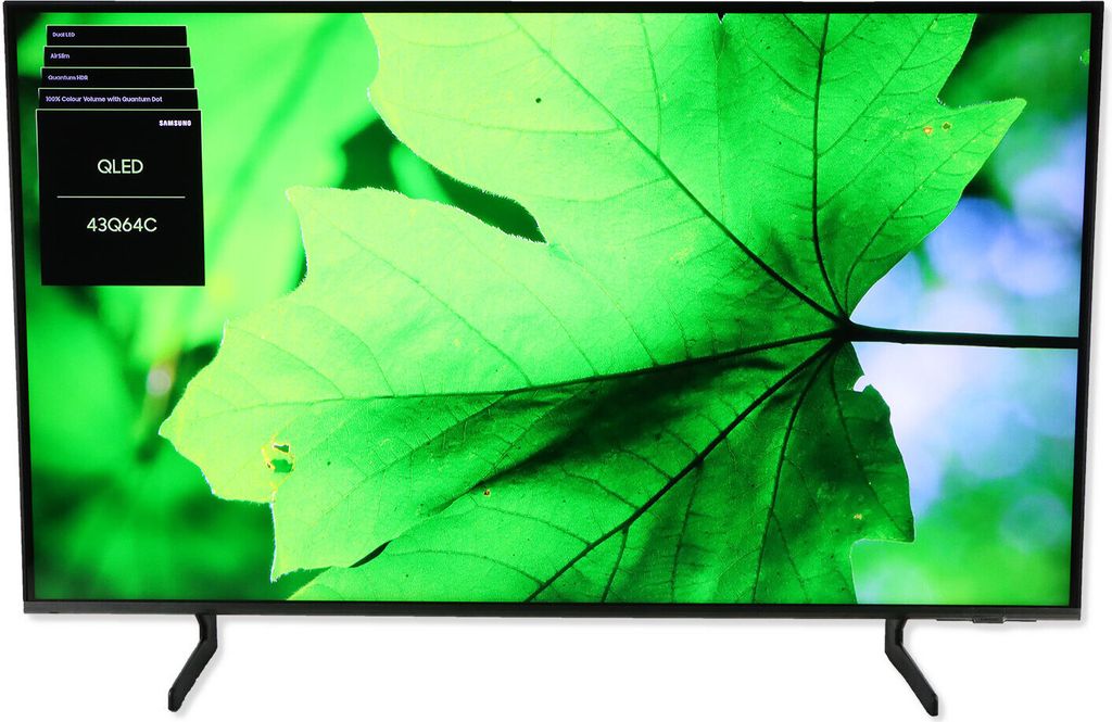 A Samsung QLED television displaying a close-up of a green leaf.