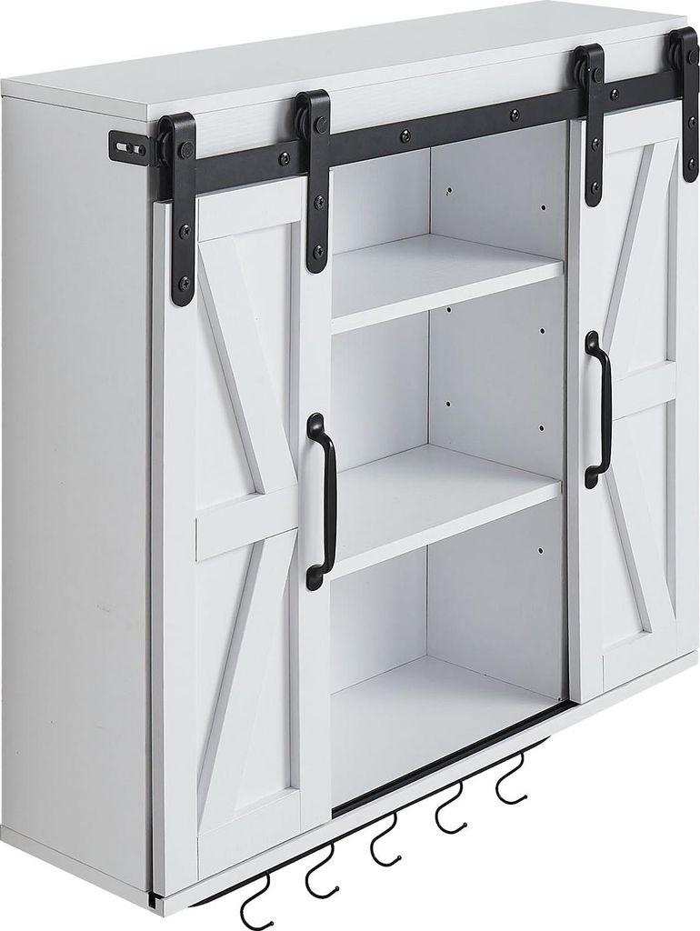 A white wall cabinet with sliding barn doors and open shelving.