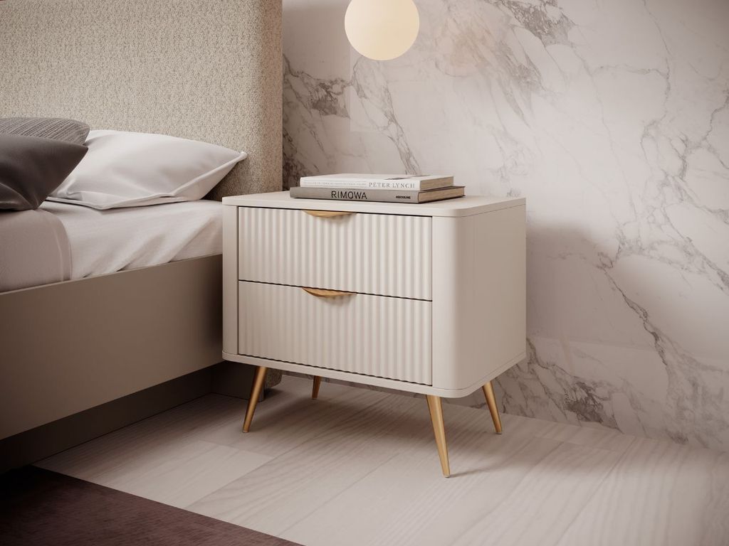 A modern bedroom setting with a nightstand next to a bed.