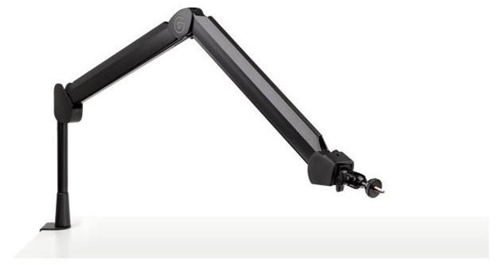 A black adjustable microphone arm is mounted on a white surface.