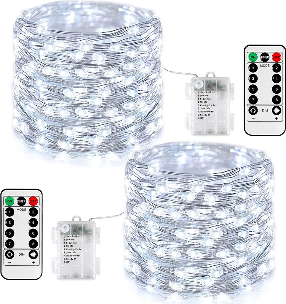 Two spools of white LED string lights with battery packs and remote controls.