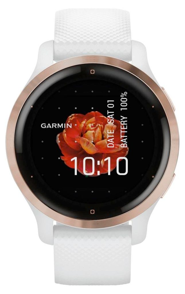 A close-up front view of a Garmin smartwatch with a white band and rose gold bezel, displaying the time and date on its screen.