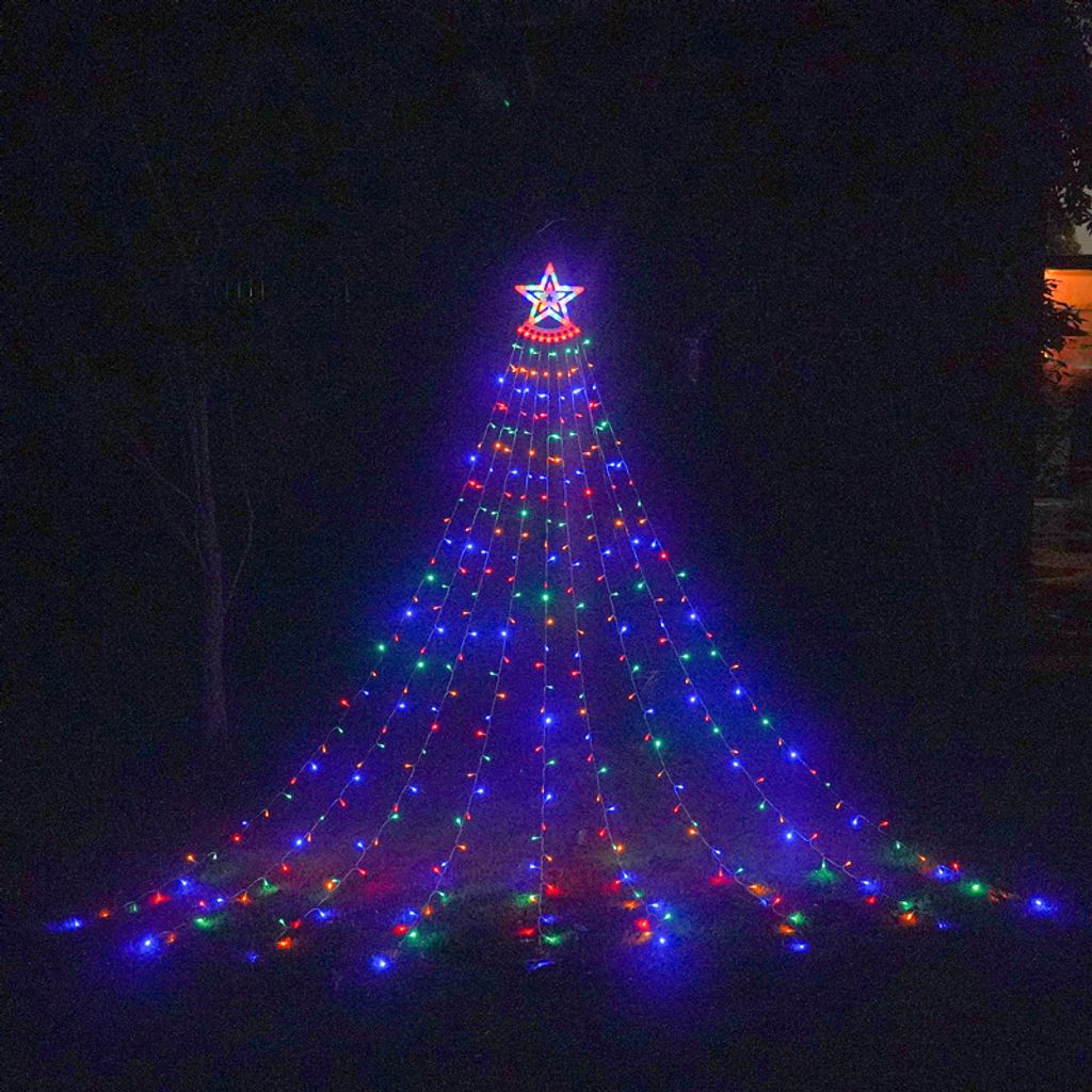 A star-shaped waterfall light decoration resembling a Christmas tree, illuminated with colorful LED lights, set up outdoors at night.