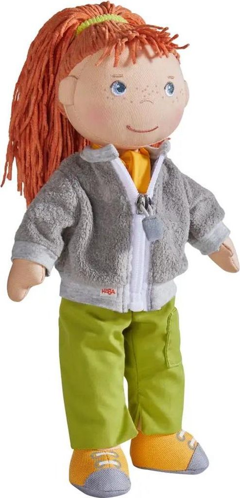 A full-body studio shot of a Haba doll.