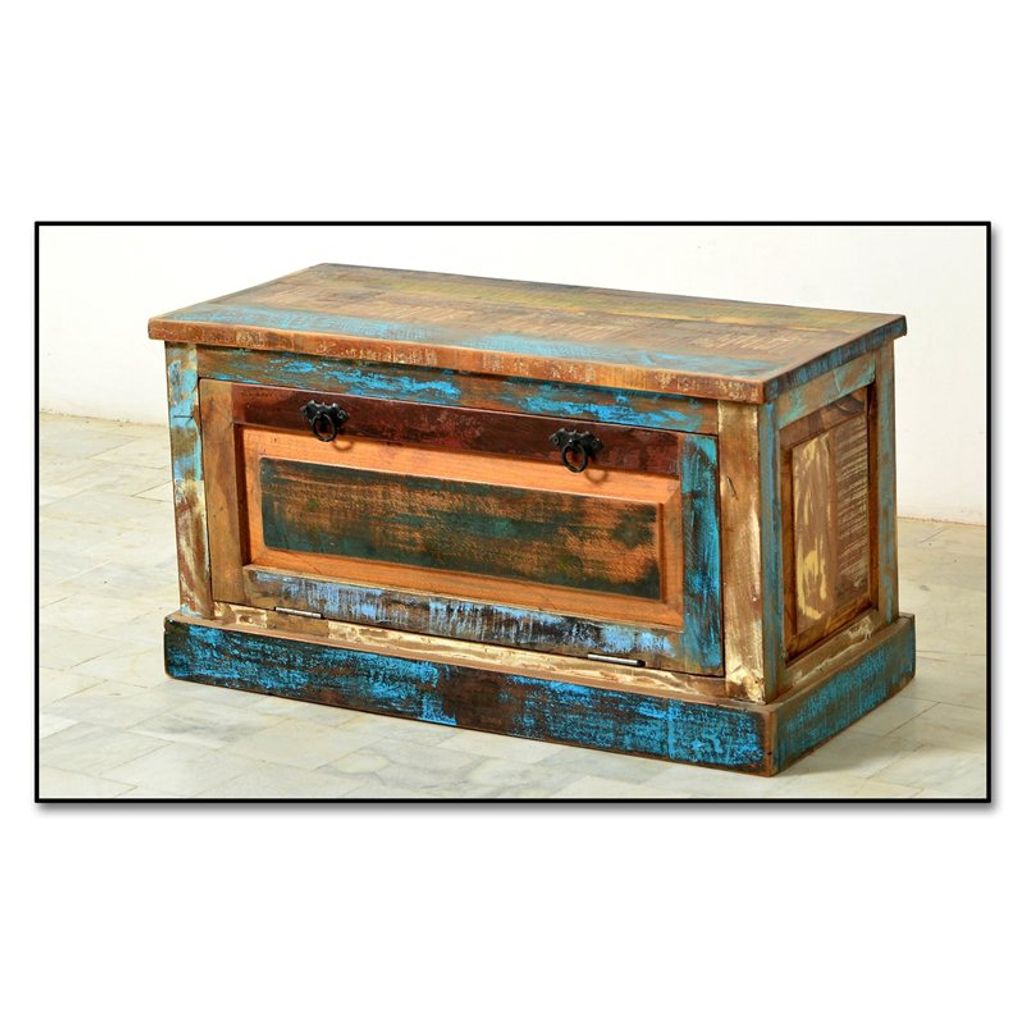 A rustic, multi-colored wooden chest or cabinet.