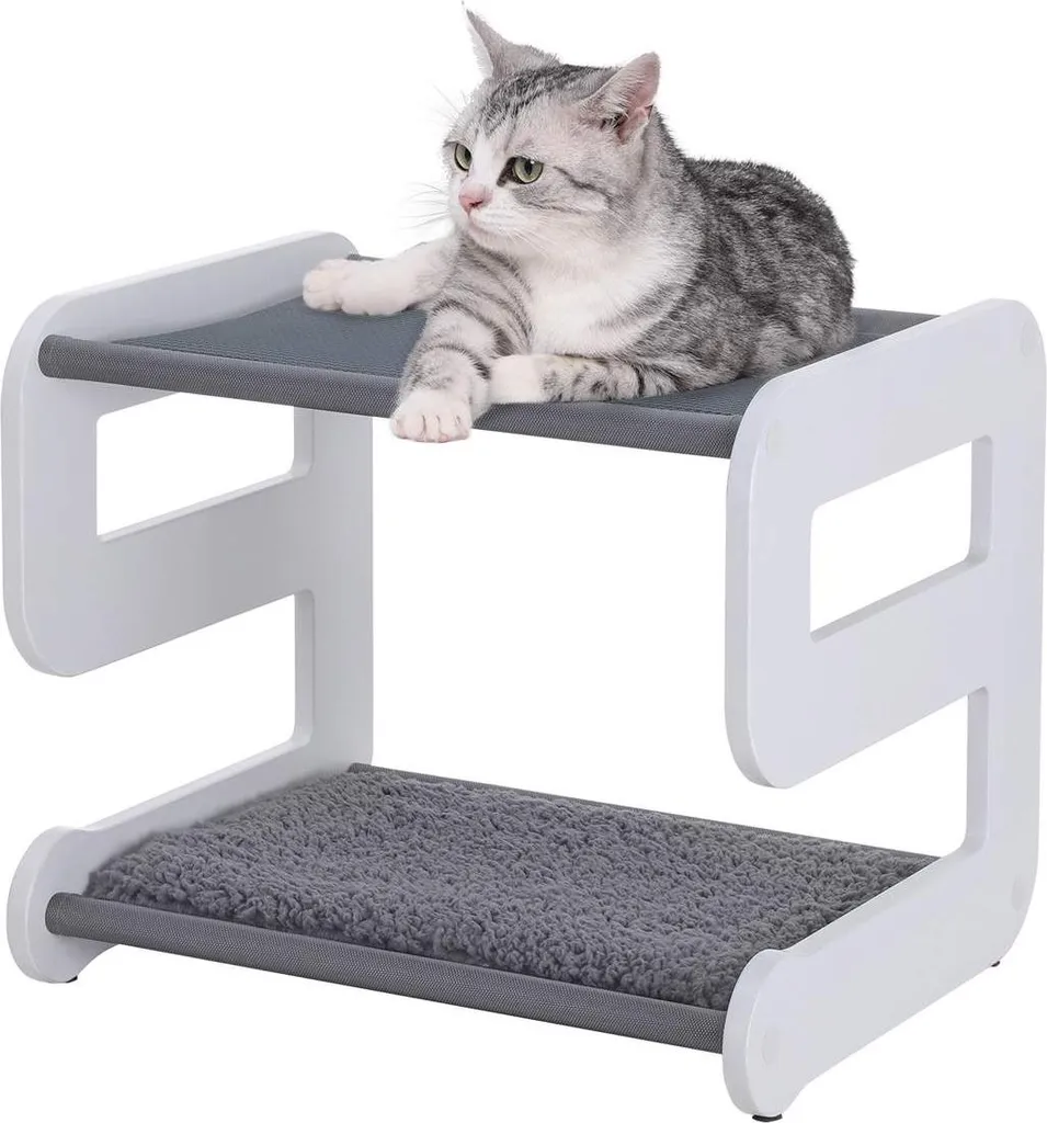 Couchage pour chat gris blanc forme de 9 idéal pour petits espaces