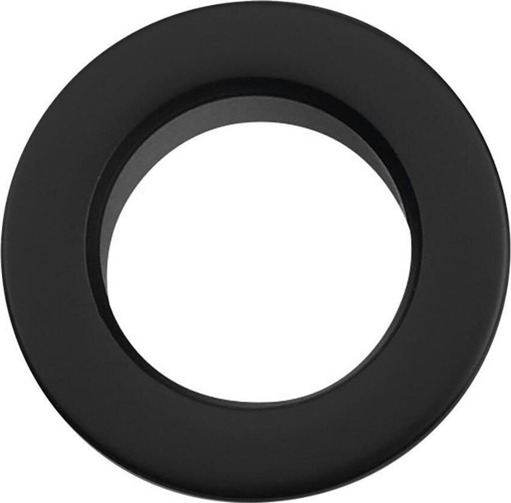 A black ring-shaped object, likely a sink overflow cover, is shown against a white background.