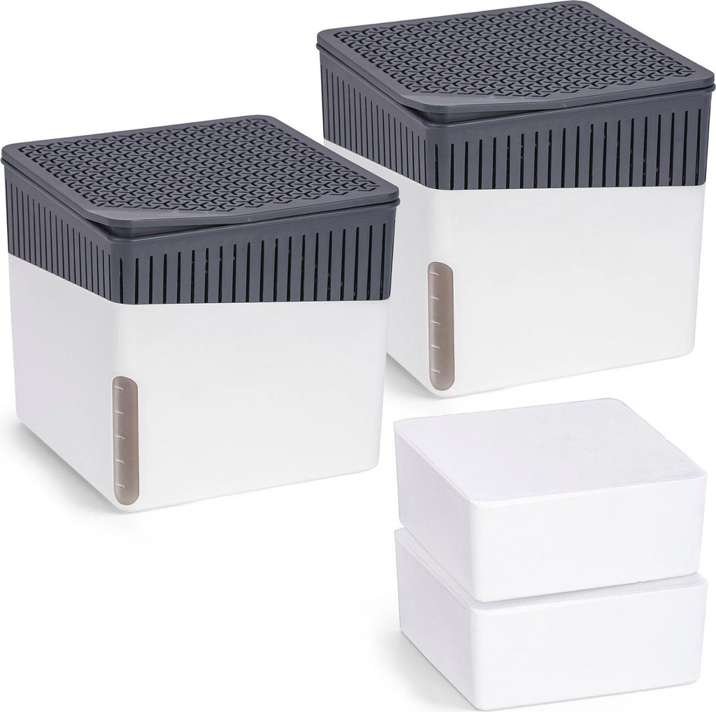 Two dehumidifier units and two empty containers are arranged on a white background.