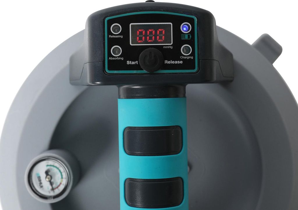 Close-up of a suction cup device with a digital display and a pressure gauge.