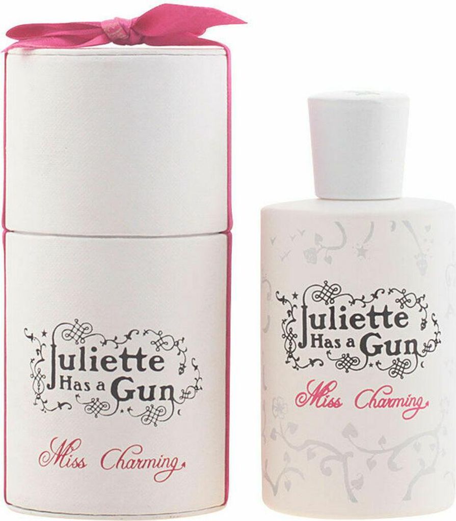 A perfume bottle and its cylindrical packaging are displayed side-by-side against a white background.