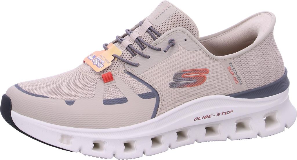 A side view of a beige Skechers sneaker.