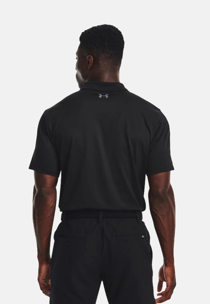 A man wearing a black polo shirt and black pants, viewed from the back.