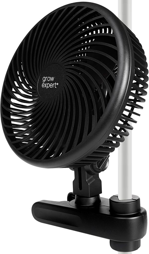 A close-up of a black clip-on fan attached to a white pole, with the fan angled towards the viewer.