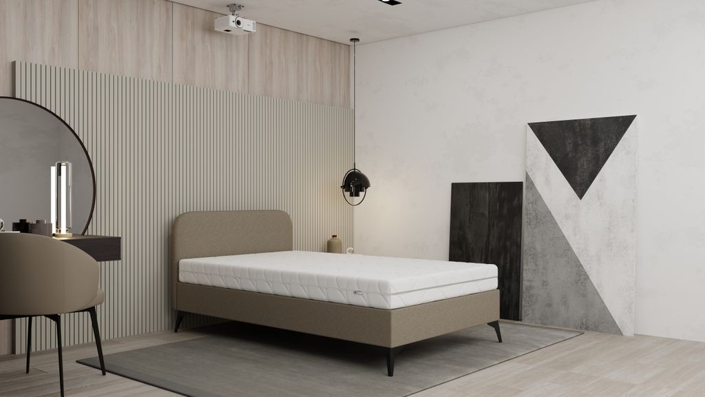 A bedroom scene with a bed, vanity, and abstract art.