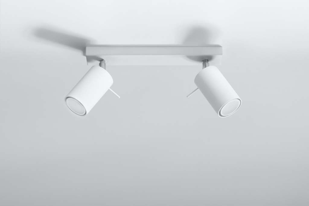 A white ceiling light fixture with two adjustable spotlights is mounted on a white ceiling.