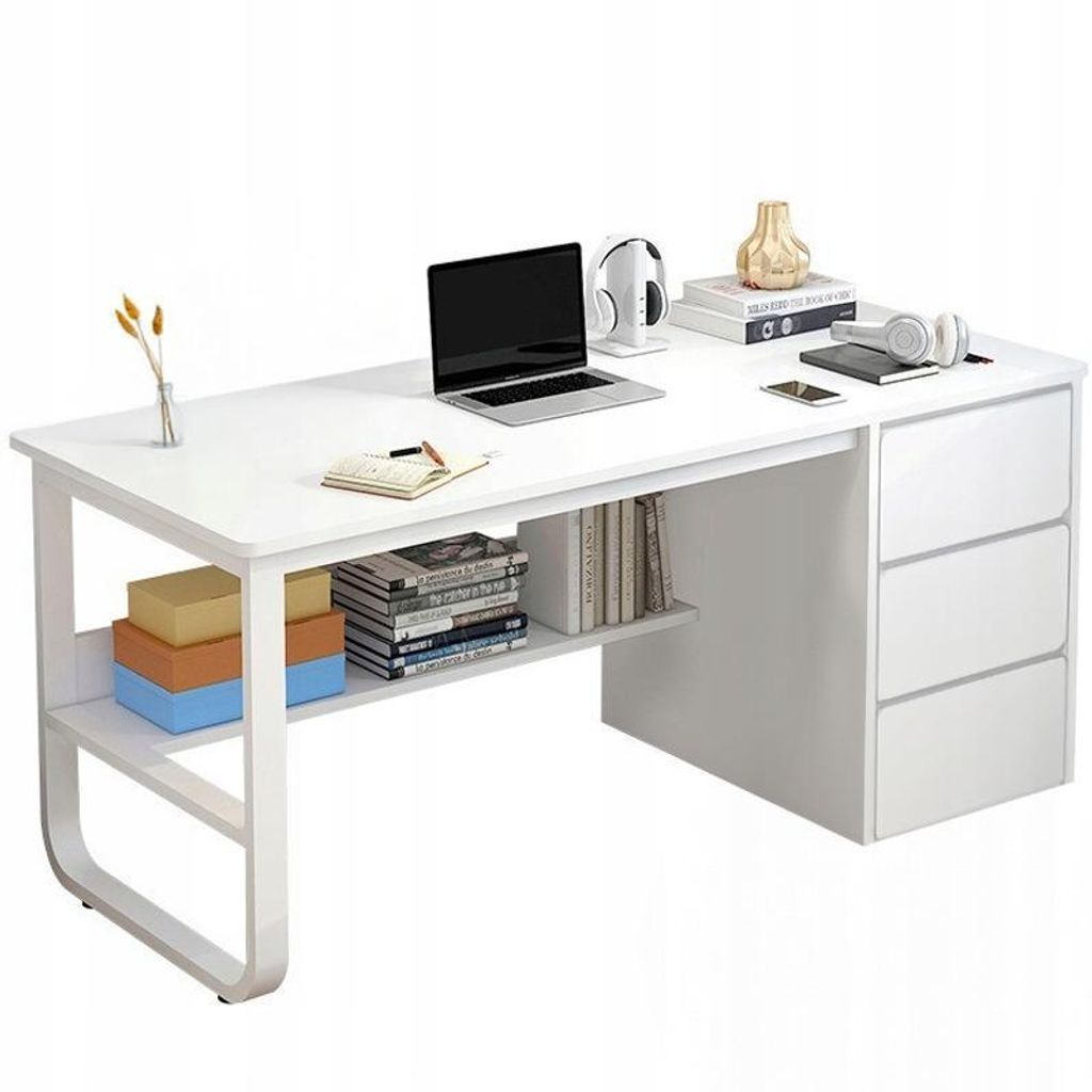 A white desk with a laptop, headphones, books, and decorative items.