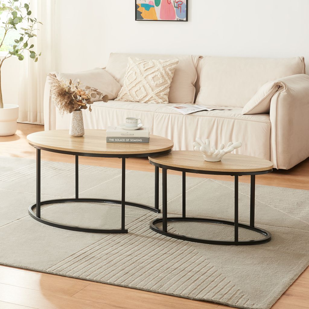 A living room scene with a sofa and two coffee tables.