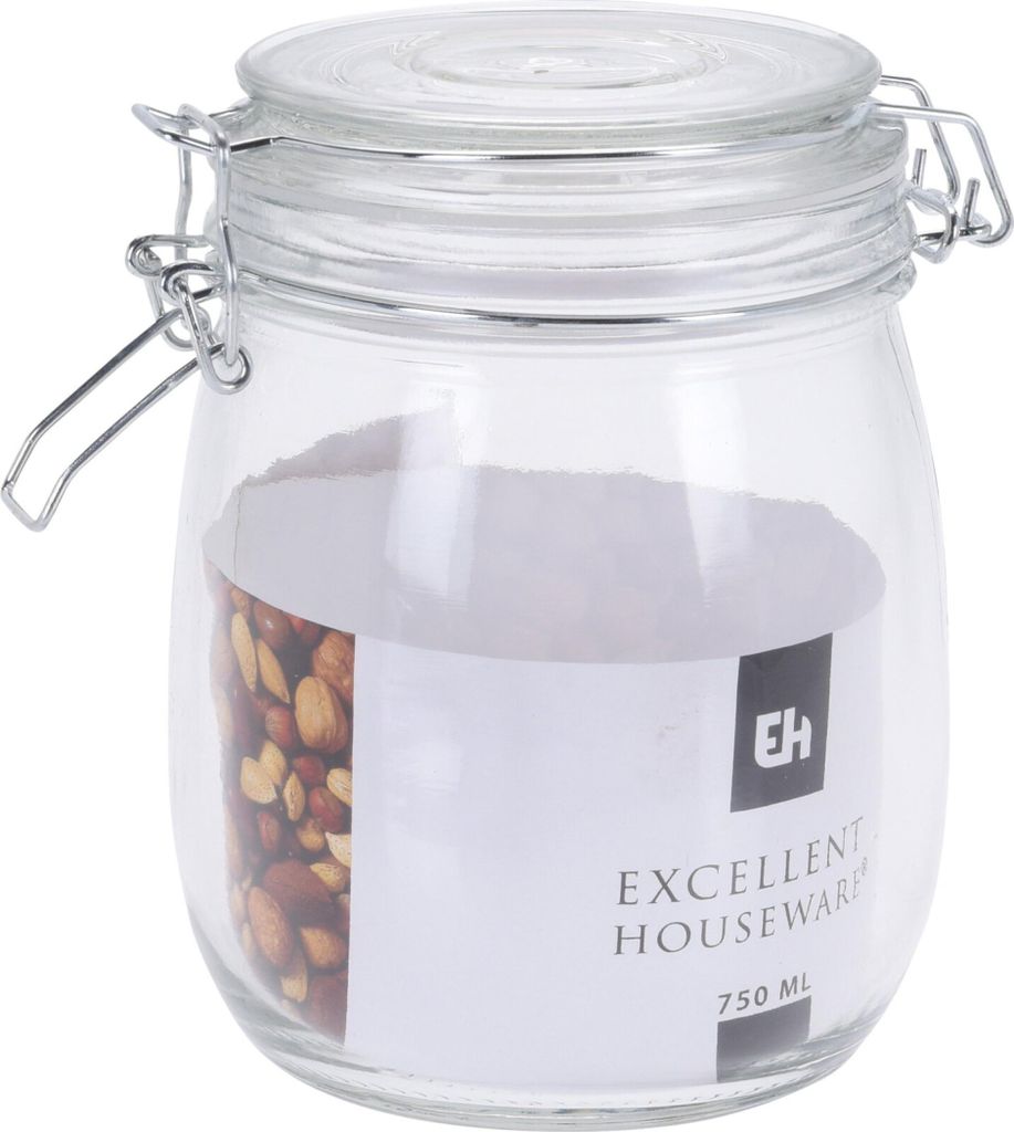 A clear glass jar with a metal clasp lid, filled with nuts and a label.