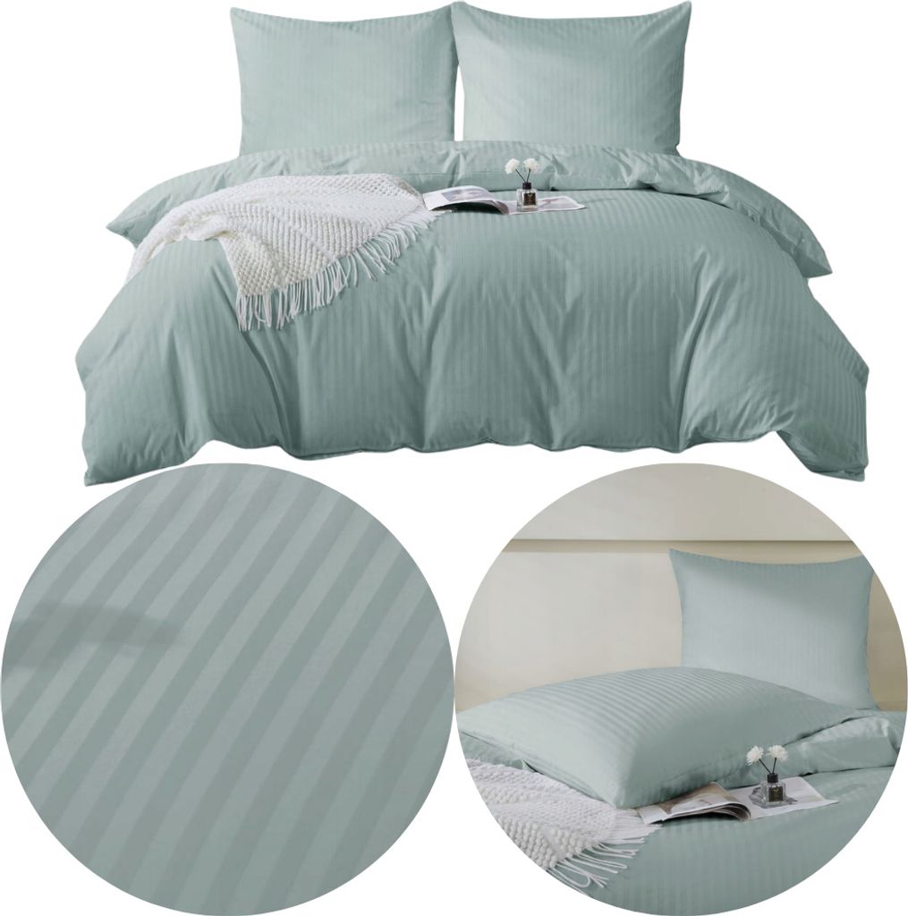 A neatly made bed with sage green striped bedding and two pillows.