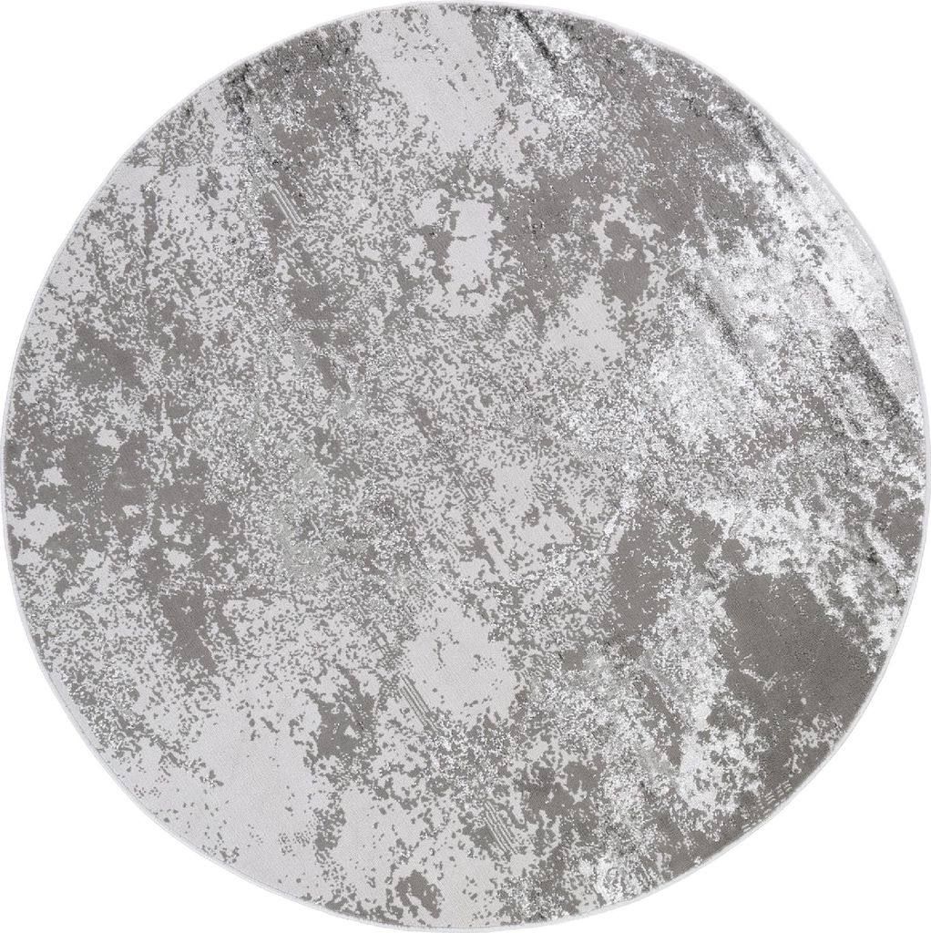 A round rug with a distressed, abstract pattern in shades of gray and white.