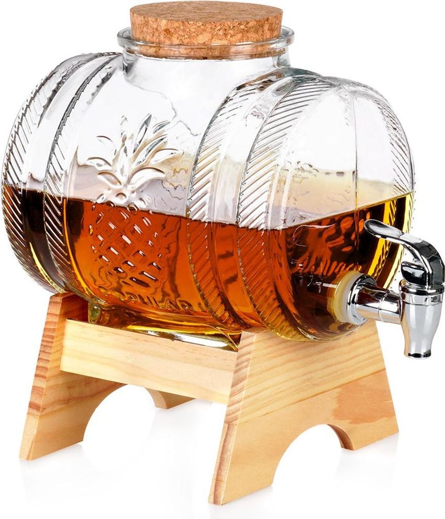 A glass beverage dispenser with a spigot, filled with a brown liquid, resting on a wooden stand.